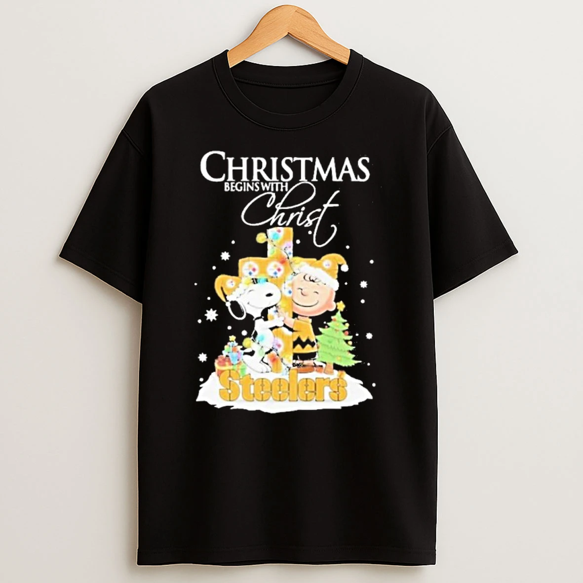 2025 Snoopy And Charlie Brown The Peanuts X Pittsburgh Steelers Merry Christmas Begins With Christ Tshirt Hoodie