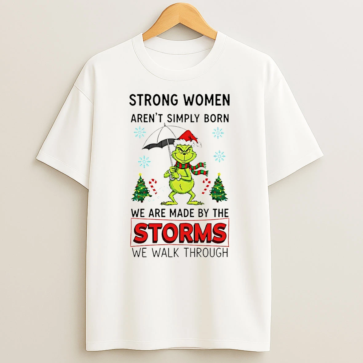 Grinch Santa Hat Strong Women Arent Simply Born We Are Made By The Storms We Walk Through Merry Christmas Tshirt Hoodie