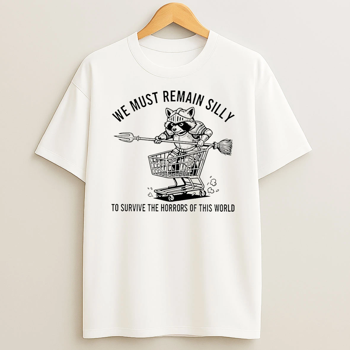 Raccoon We Must Remain Silly To Survive The Horrors Of This World T Shirt