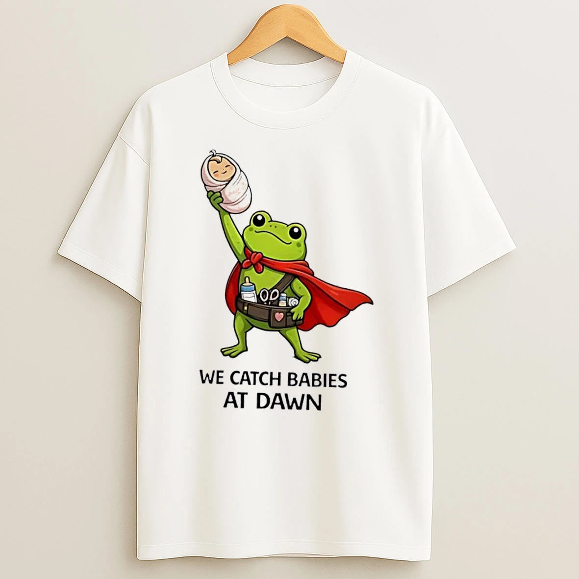 Officials We Catch Babies At Dawn Cartoon Cape Frog Utility Belt Swaddled Infant White Womens T Shirt Sweatshirt
