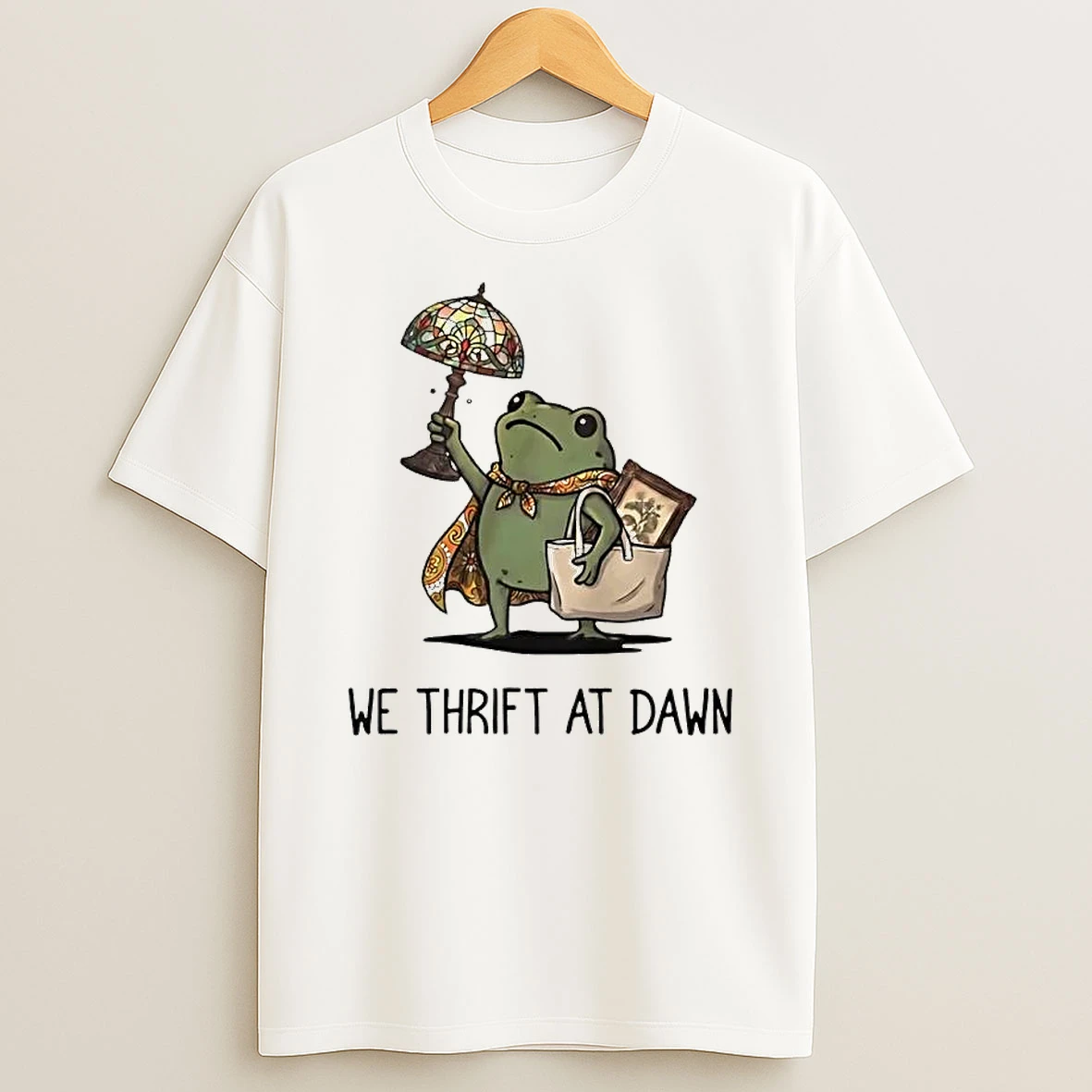 Officials We Thrift At Dawn Cartoon Frog Wearing Cape Holding Stained Glass Lamp Tote Bag T Shirt Sweatshirt